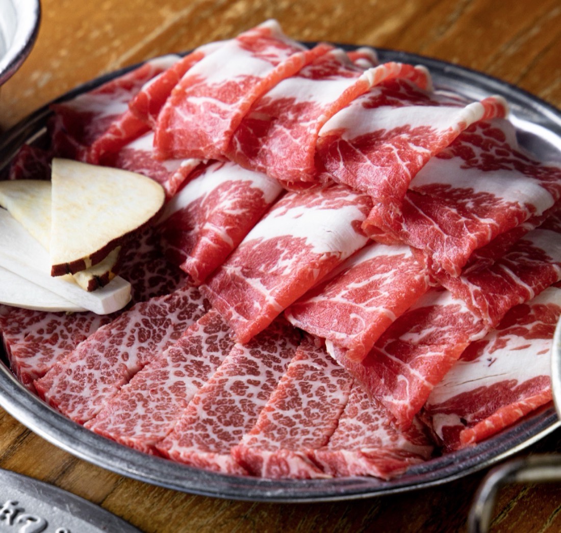 Platter of prime marbled beef ready for the grill
